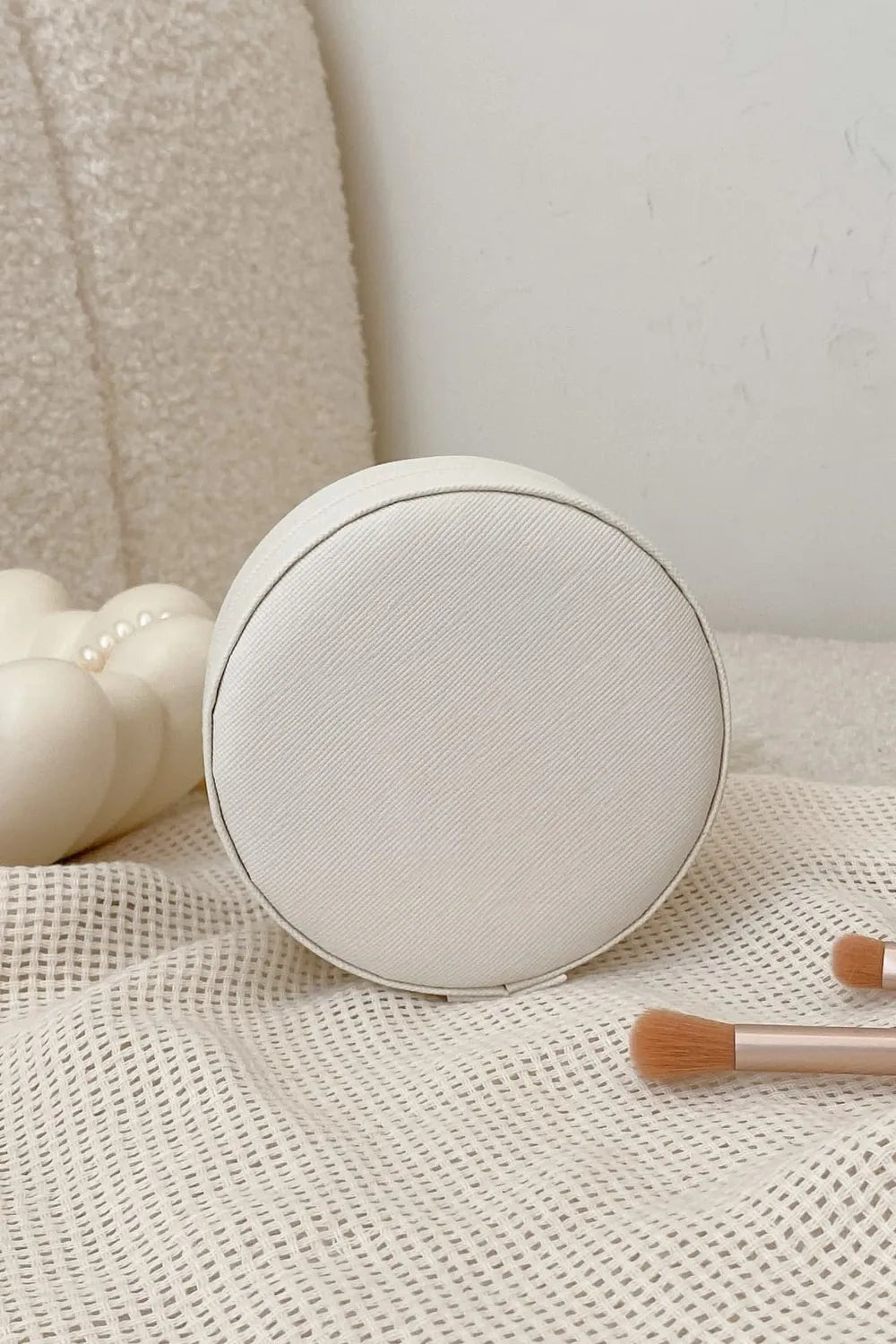 Beige PU leather round jewelry storage box with closed lid