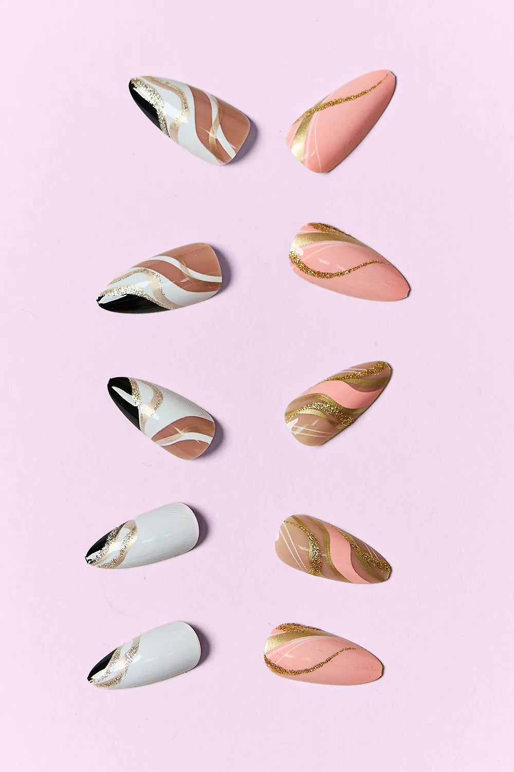 Marbled Magic press-on nails, nude base with gold swirls and dark marbled tips