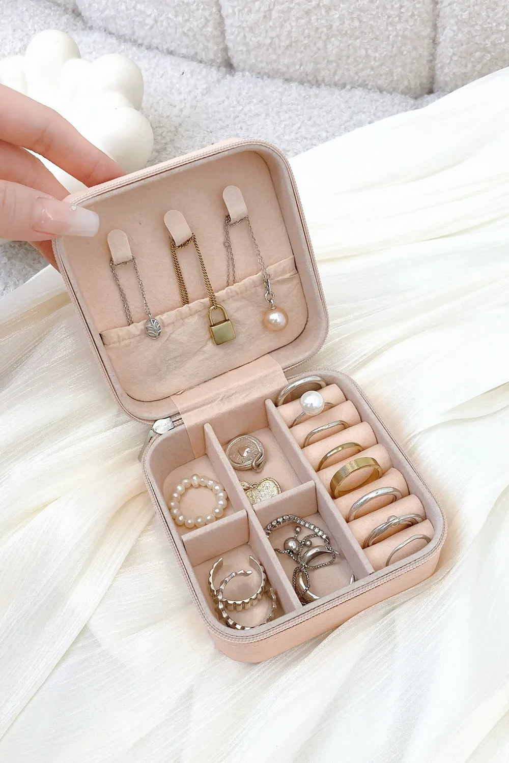 Blush pink PU leather square jewelry box, open with ring slots and necklace dividers