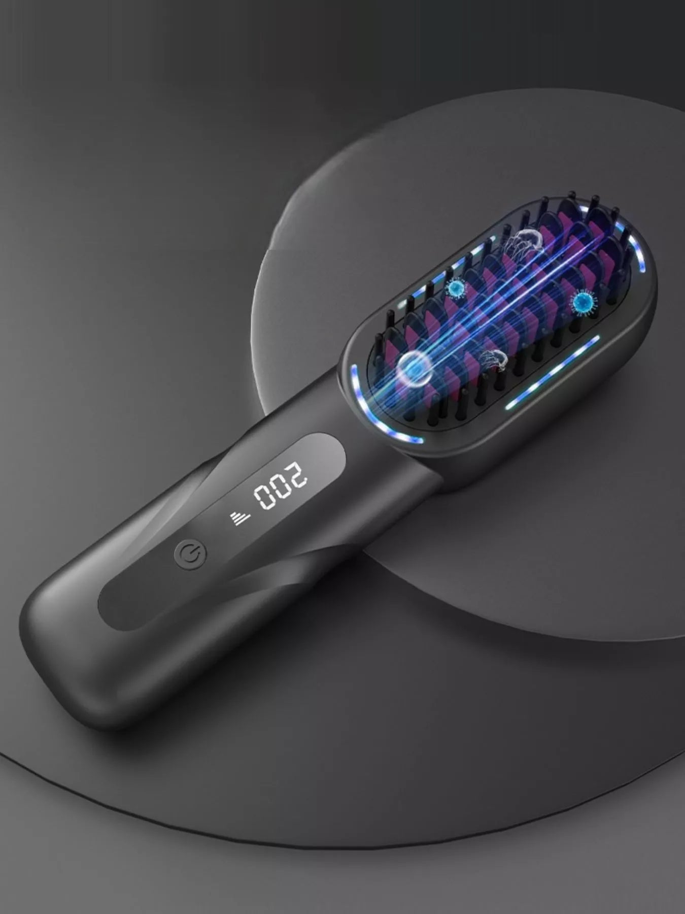 Dark gray fast heating comb with illuminated blue heating elements on the plate