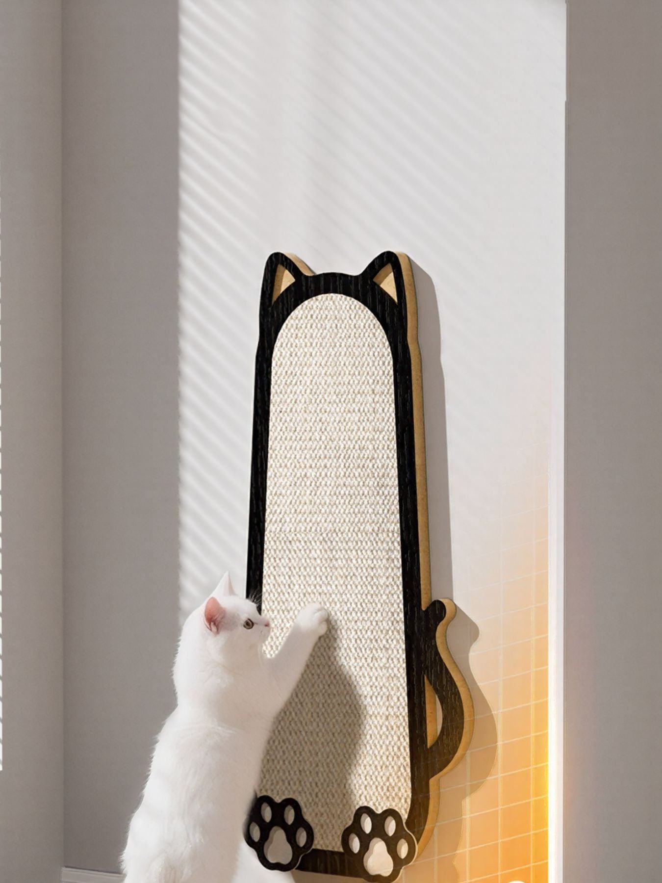 Cat-shaped scratching post with beige scratching surface and black paw prints at base