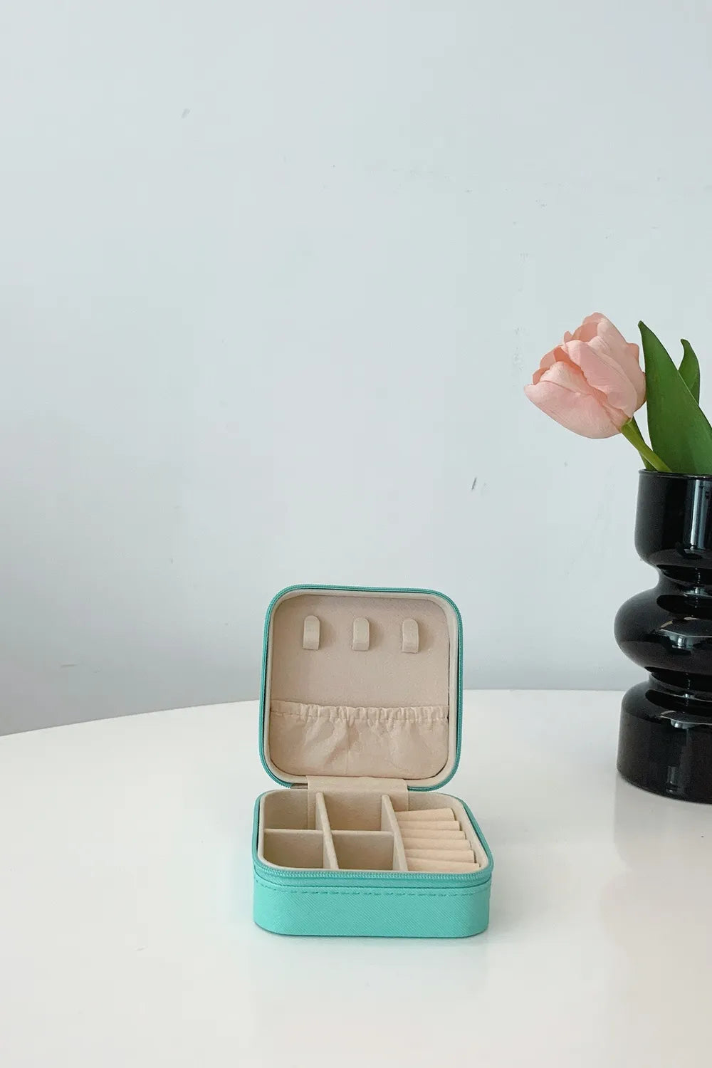 Turquoise PU leather square jewelry box open with ring slots and inner dividers