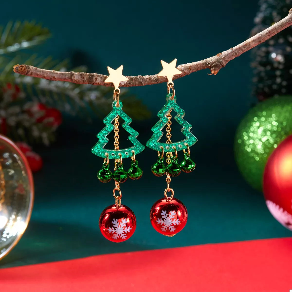 Christmas tree ball drop earrings hanging from branch: green trees and red baubles