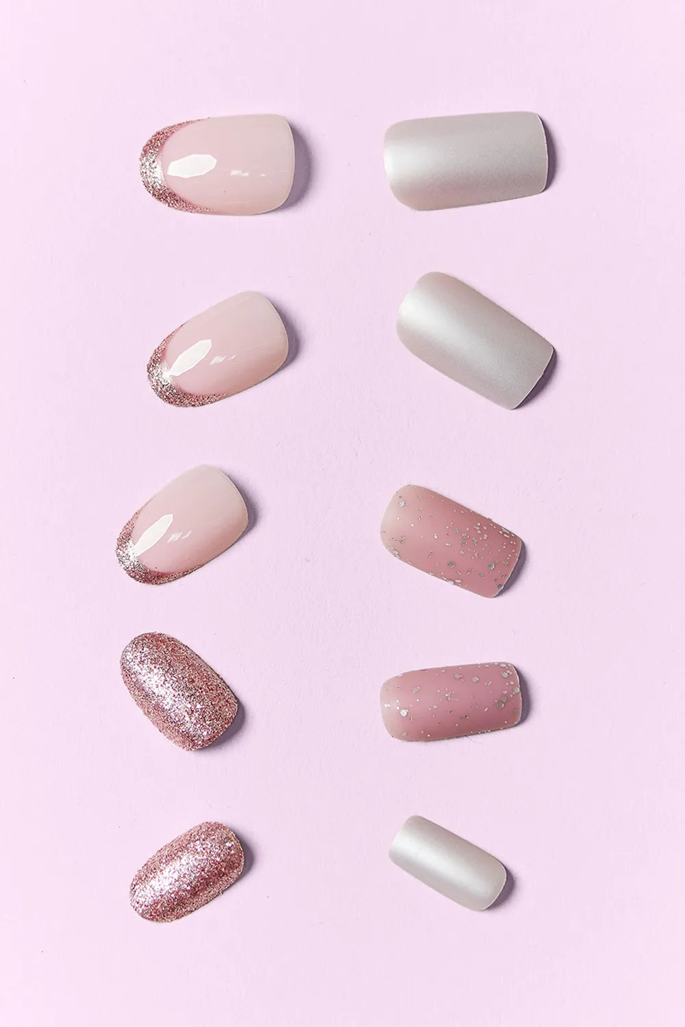 Blush Bliss press on nails: nude blush, silver glitter, and pale white glossy tips