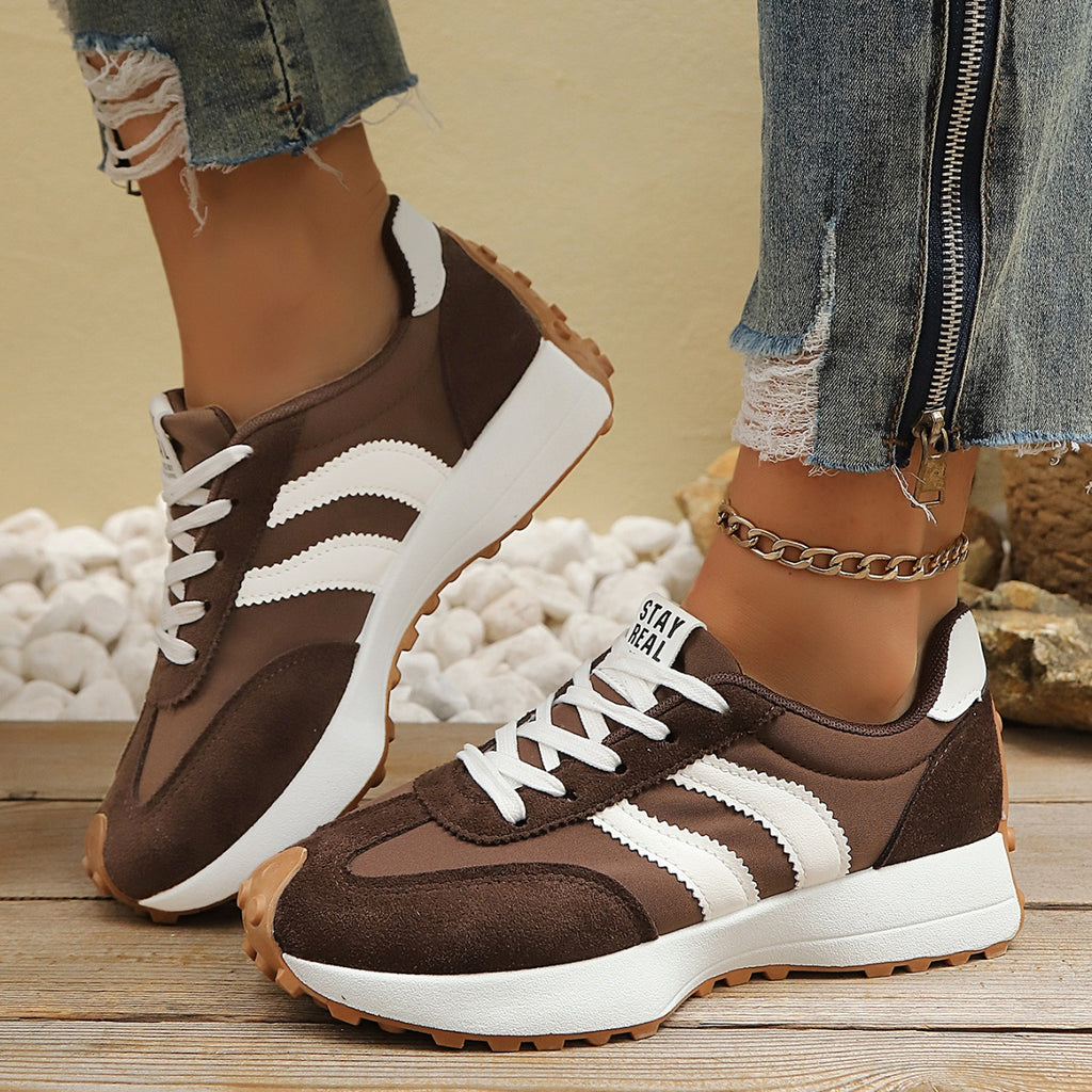 Brown lace-up sneakers with white stripes, contrast paneling, rubber traction sole