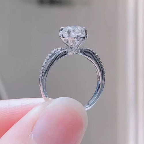 Sterling silver moissanite ring band with round halo setting, side view