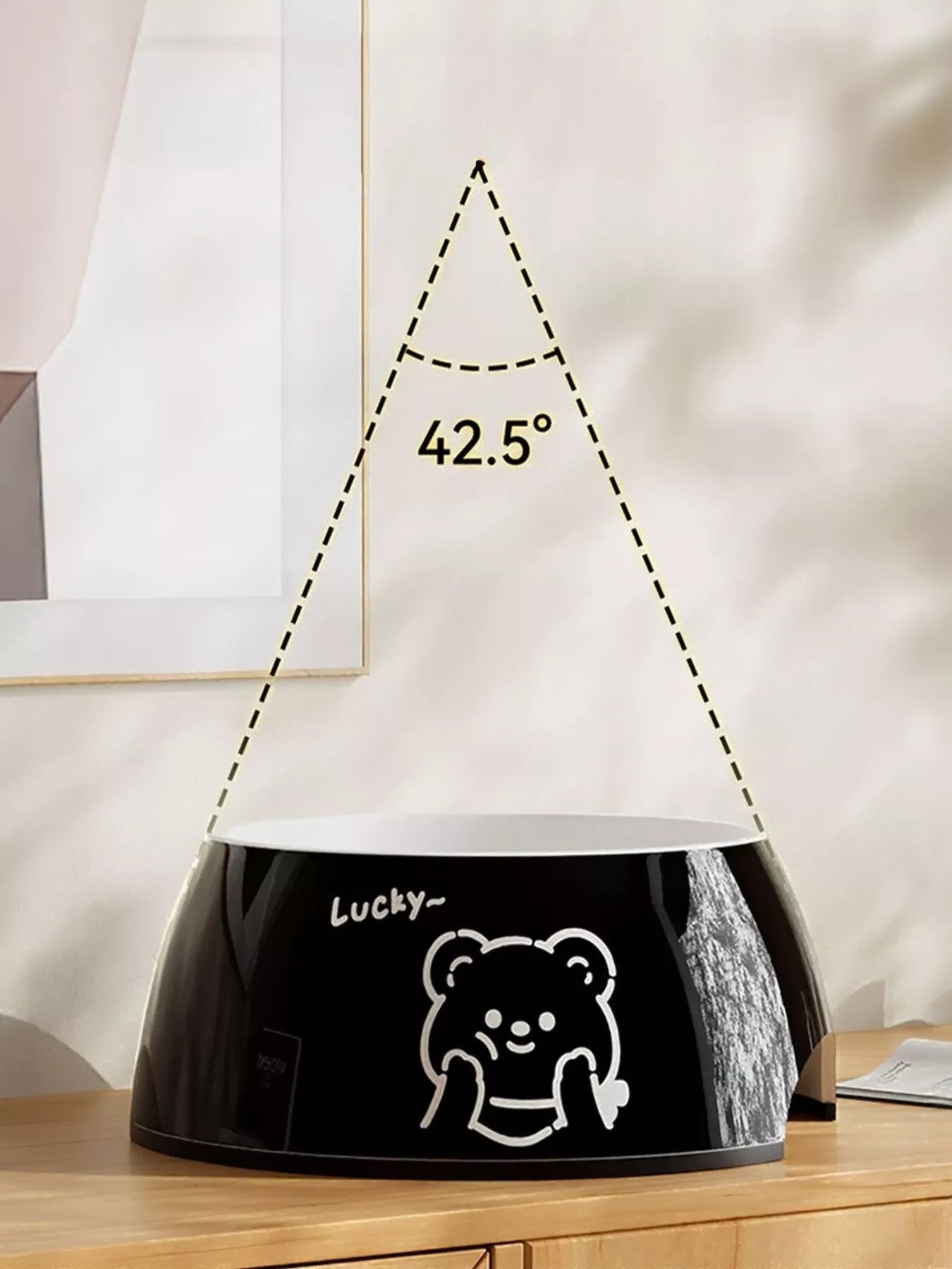 Black pet bowl with bear cartoon graphic and Lucky text on front