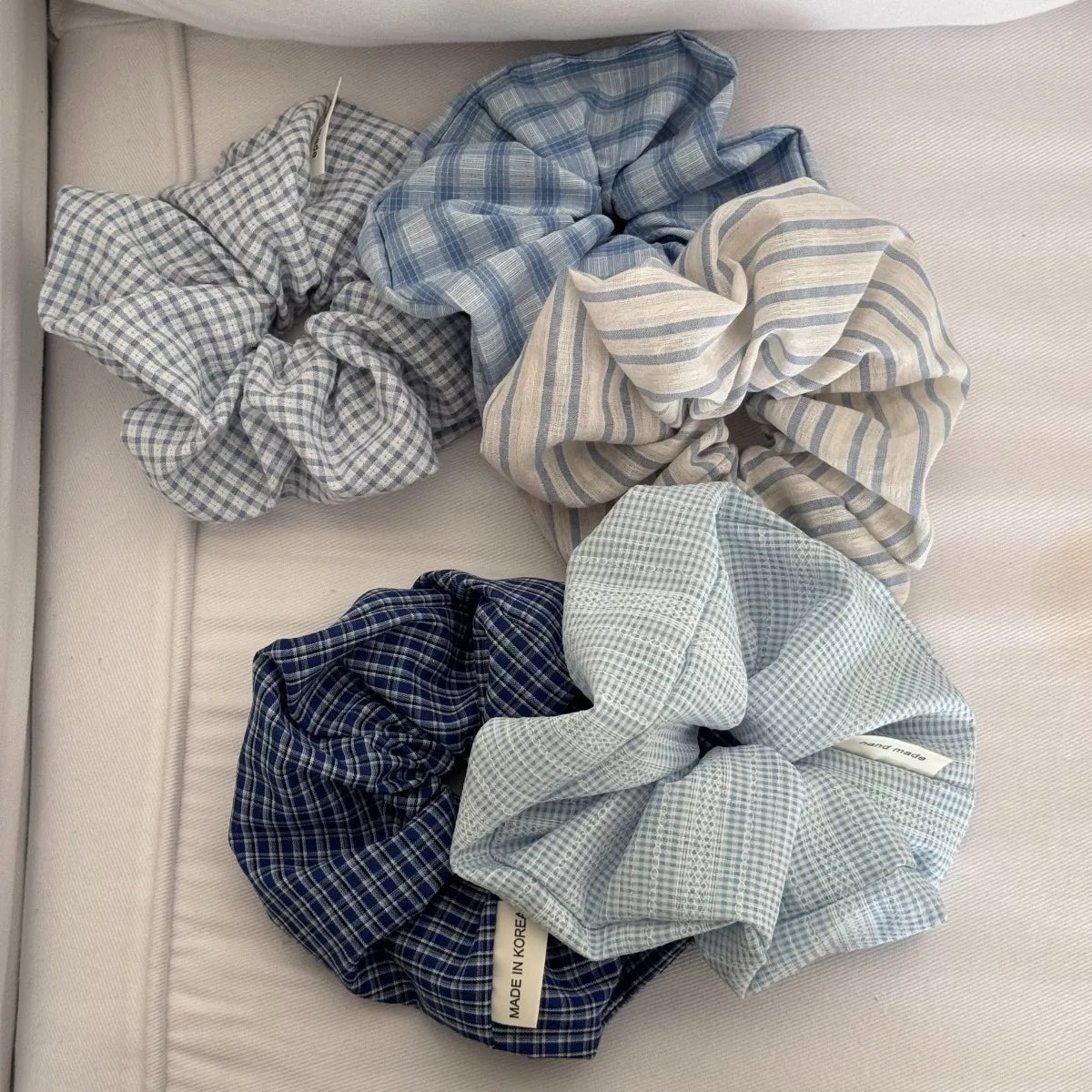 Light blue scrunchie set with navy-blue plaid and striped scrunchies