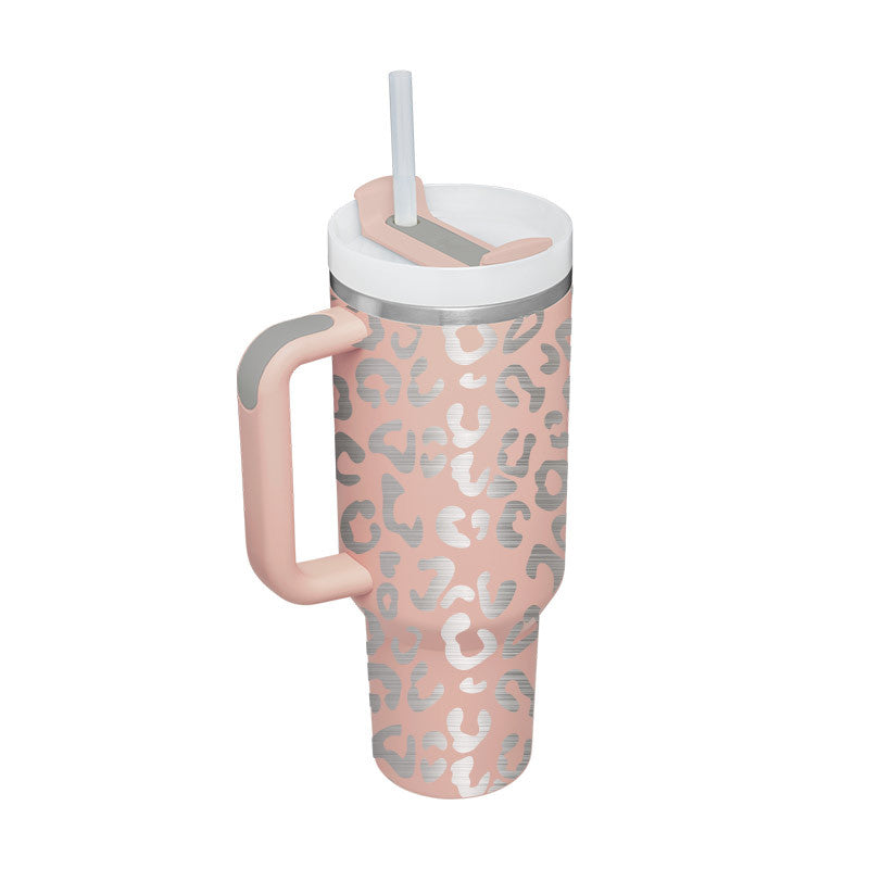 Light pink 40 oz insulated tumbler with handle, clear straw, and abstract animal print