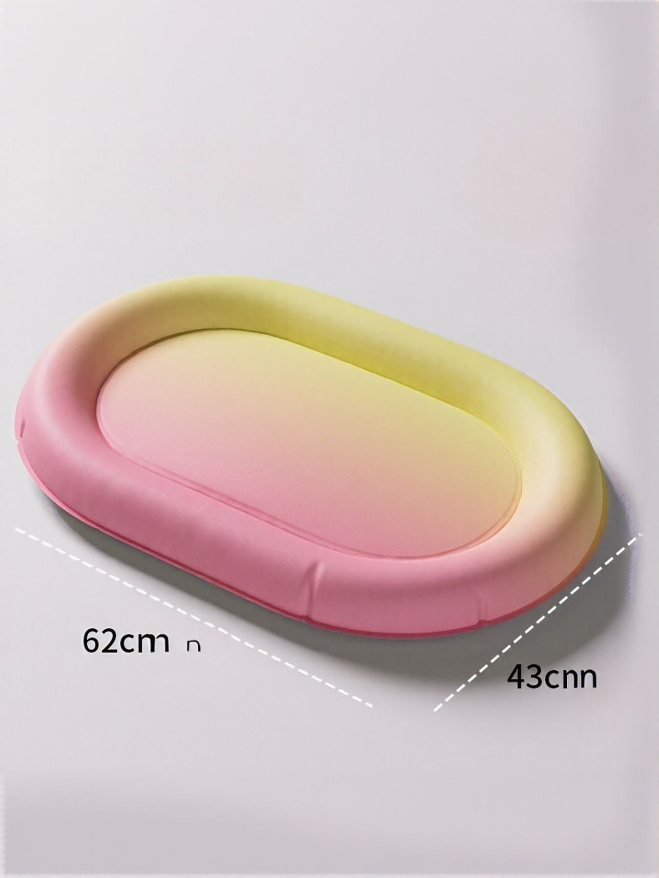 Pet Ice Nest oval lounging bed with pink and yellow gradient sides