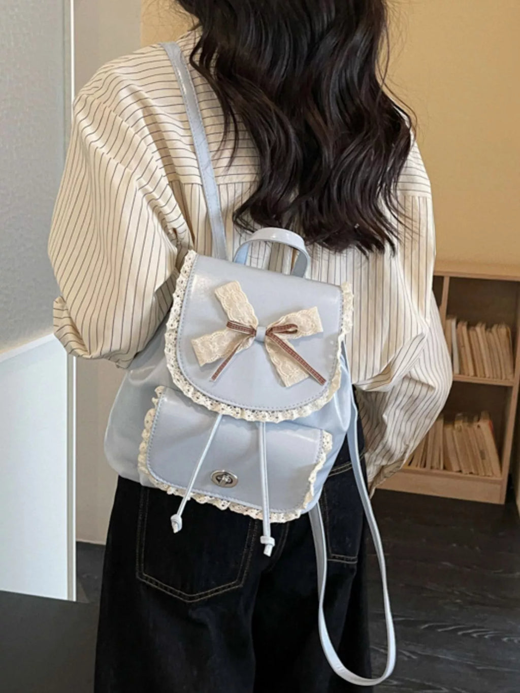 Light blue lace bowknot mini backpack with two front compartments and adjustable strap