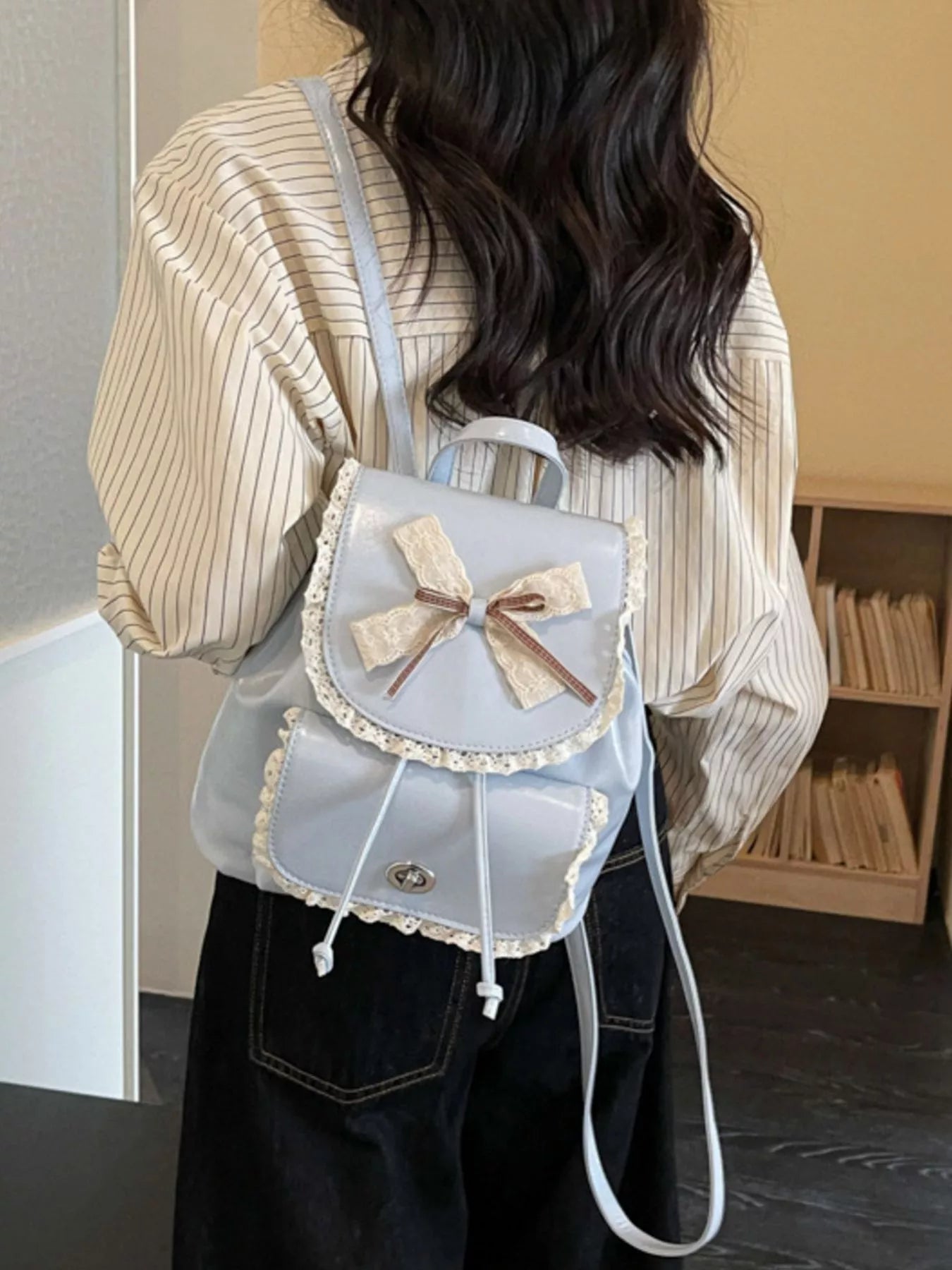 Light blue lace bowknot mini backpack with two front compartments and adjustable strap