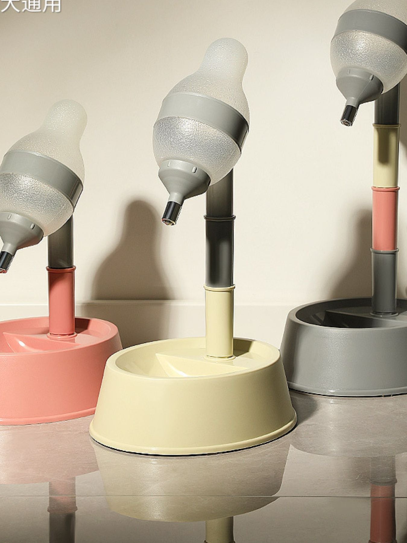 Pink, beige, and gray height-adjustable automatic pet water dispenser bowls