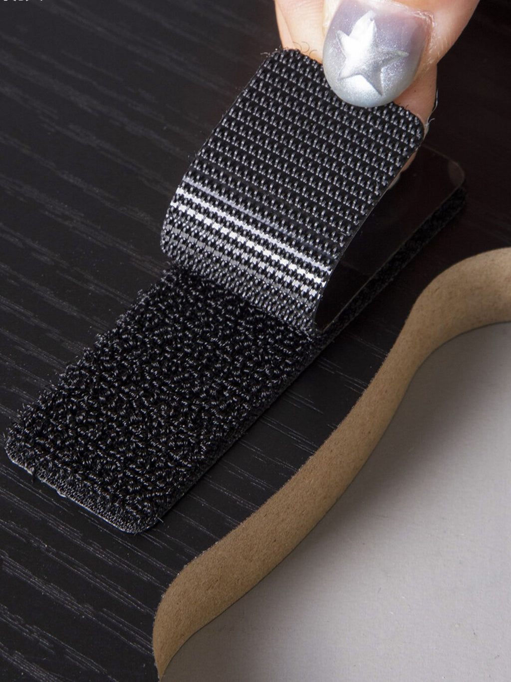 Cat-shaped scratching post with dark sisal scratching surface on cardboard base