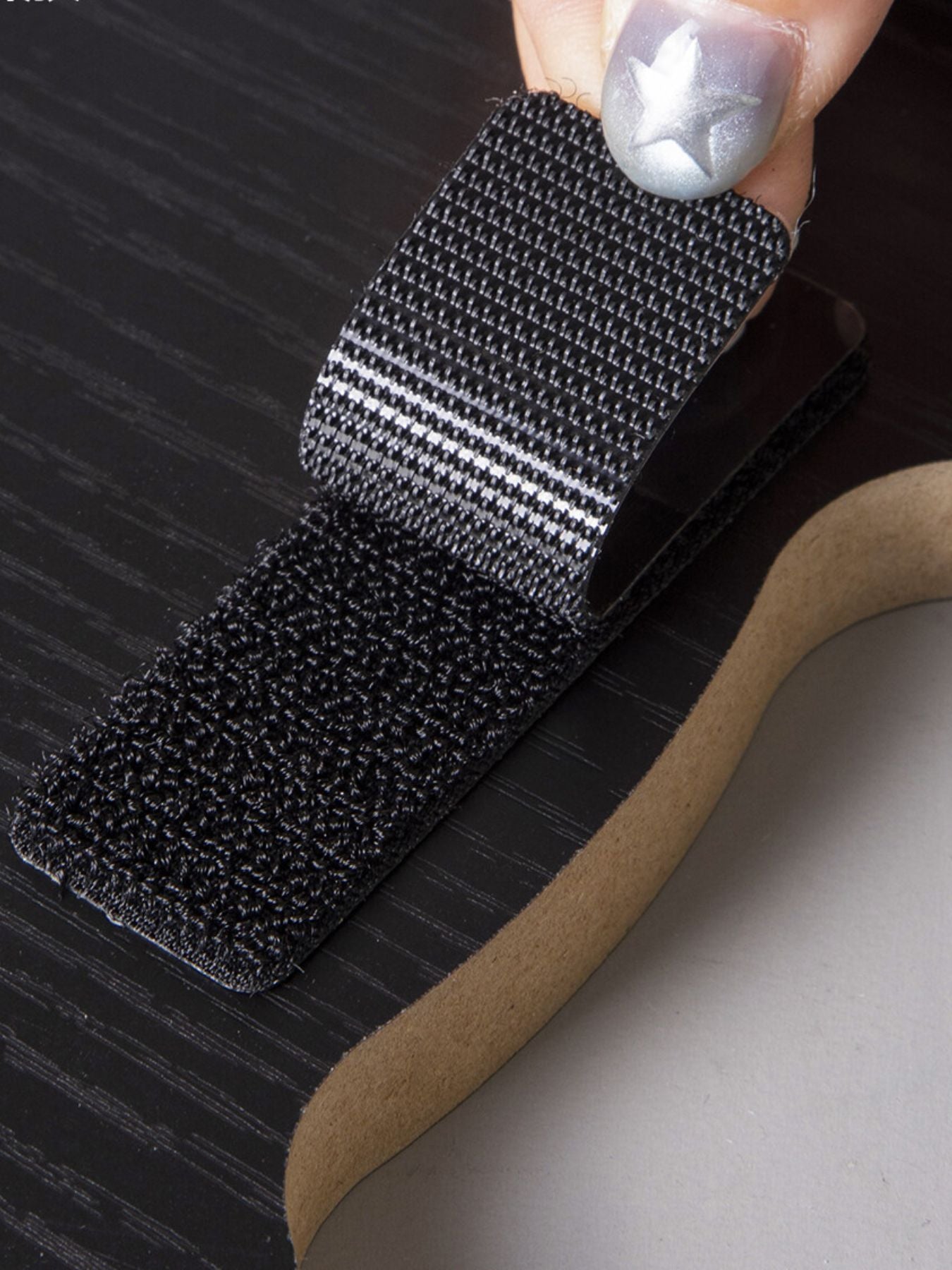Cat-shaped scratching post with dark sisal scratching surface on cardboard base