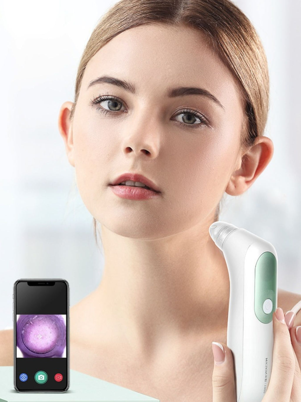 White pore vacuum blackhead extractor near face, with digital screen showing close-up