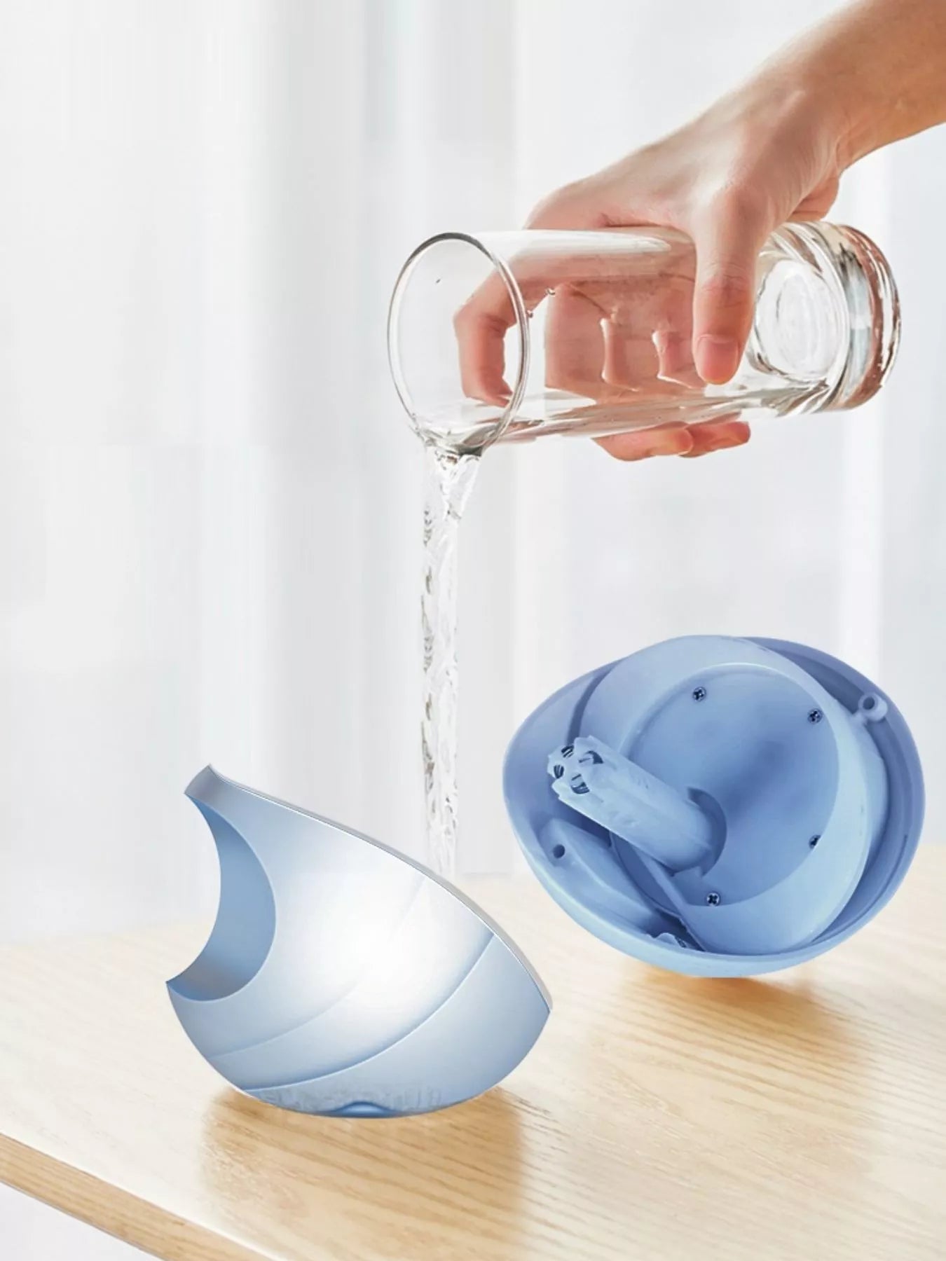 Apple-shaped humidifier with open top and water fill opening, light blue