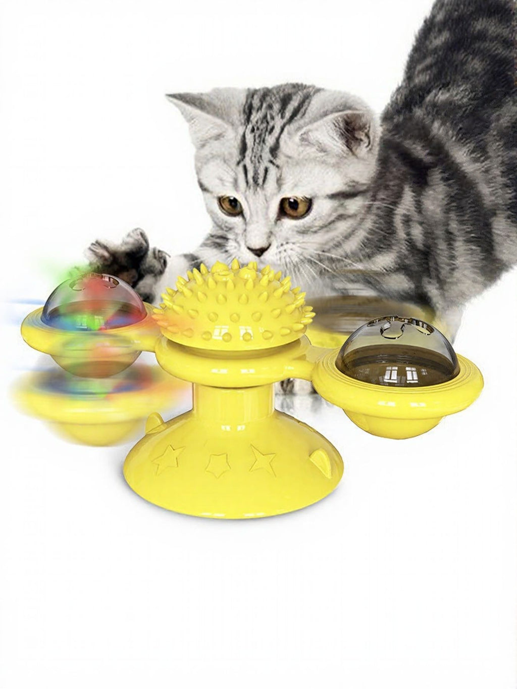 Yellow rotating cat toy set with suction cup domes and spiky wheel