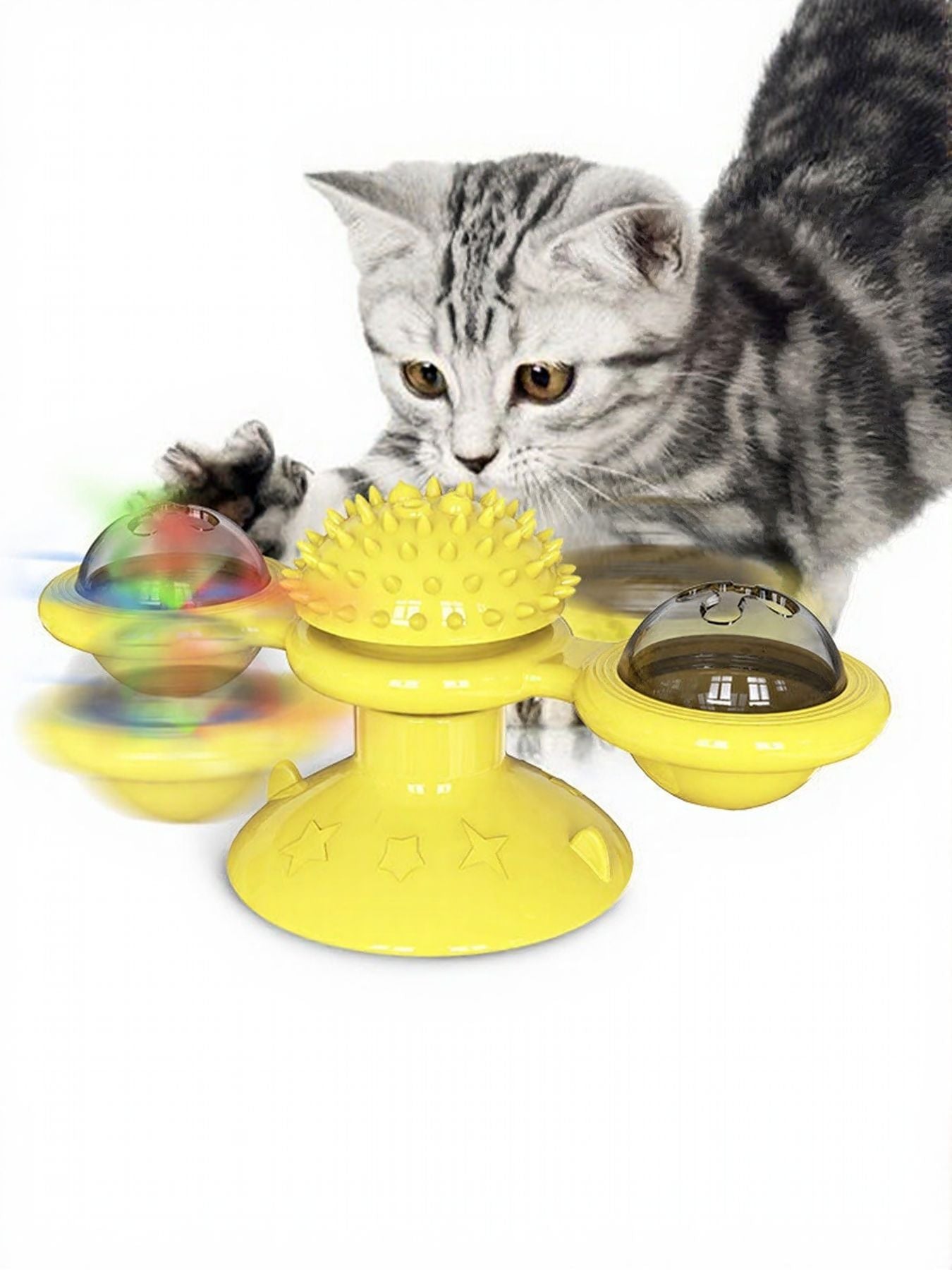 Yellow rotating cat toy set with suction cup domes and spiky wheel