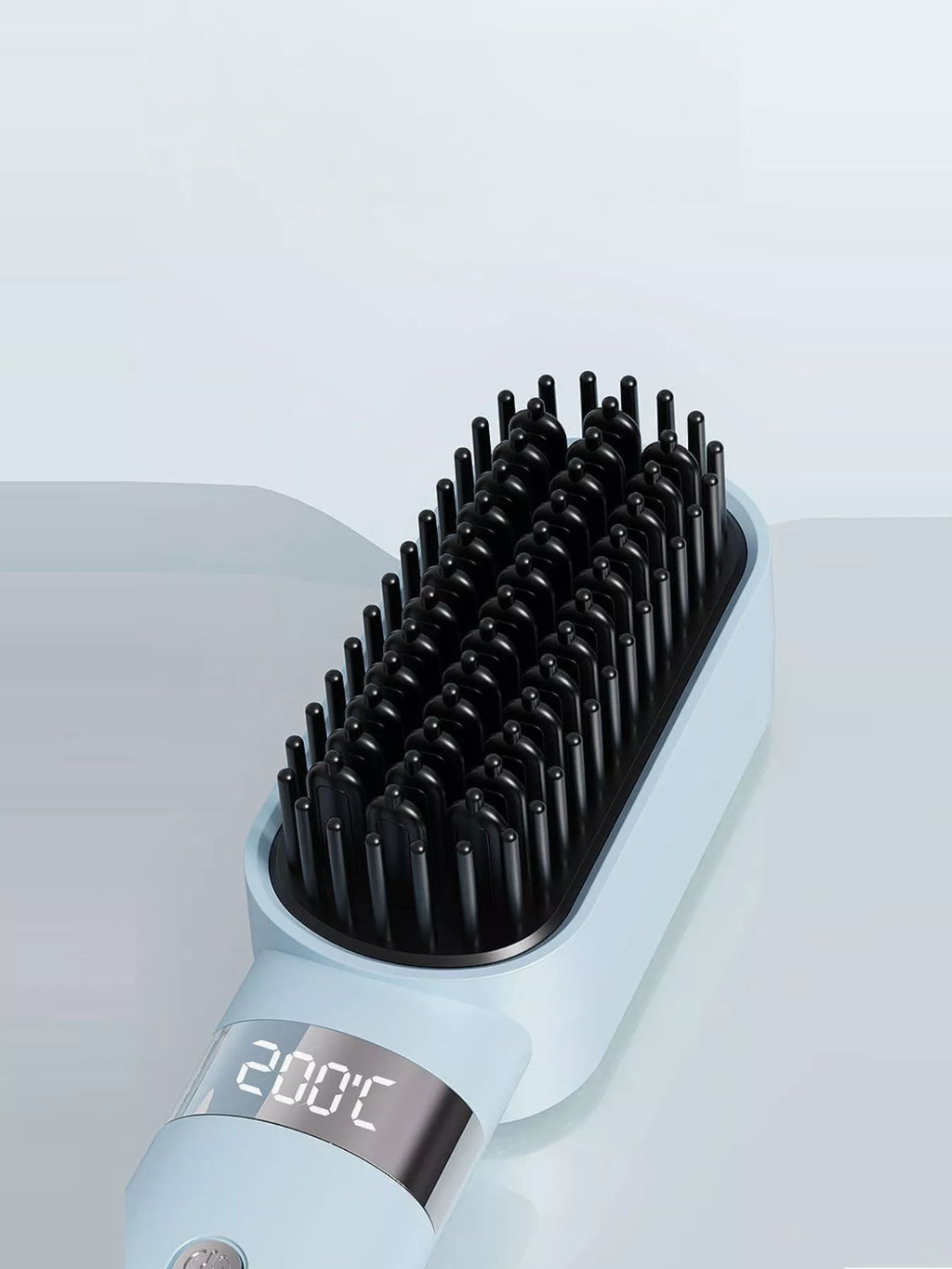 Light blue heated straightening comb with dense black pins