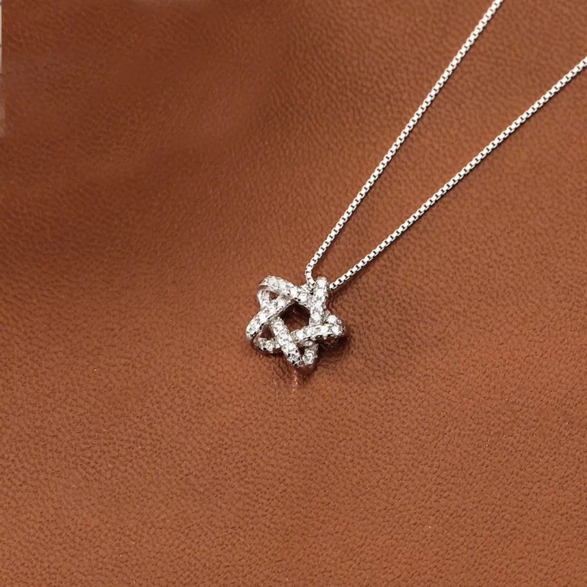 Silver zircon star pendant necklace, flat star cluster detail on thin chain