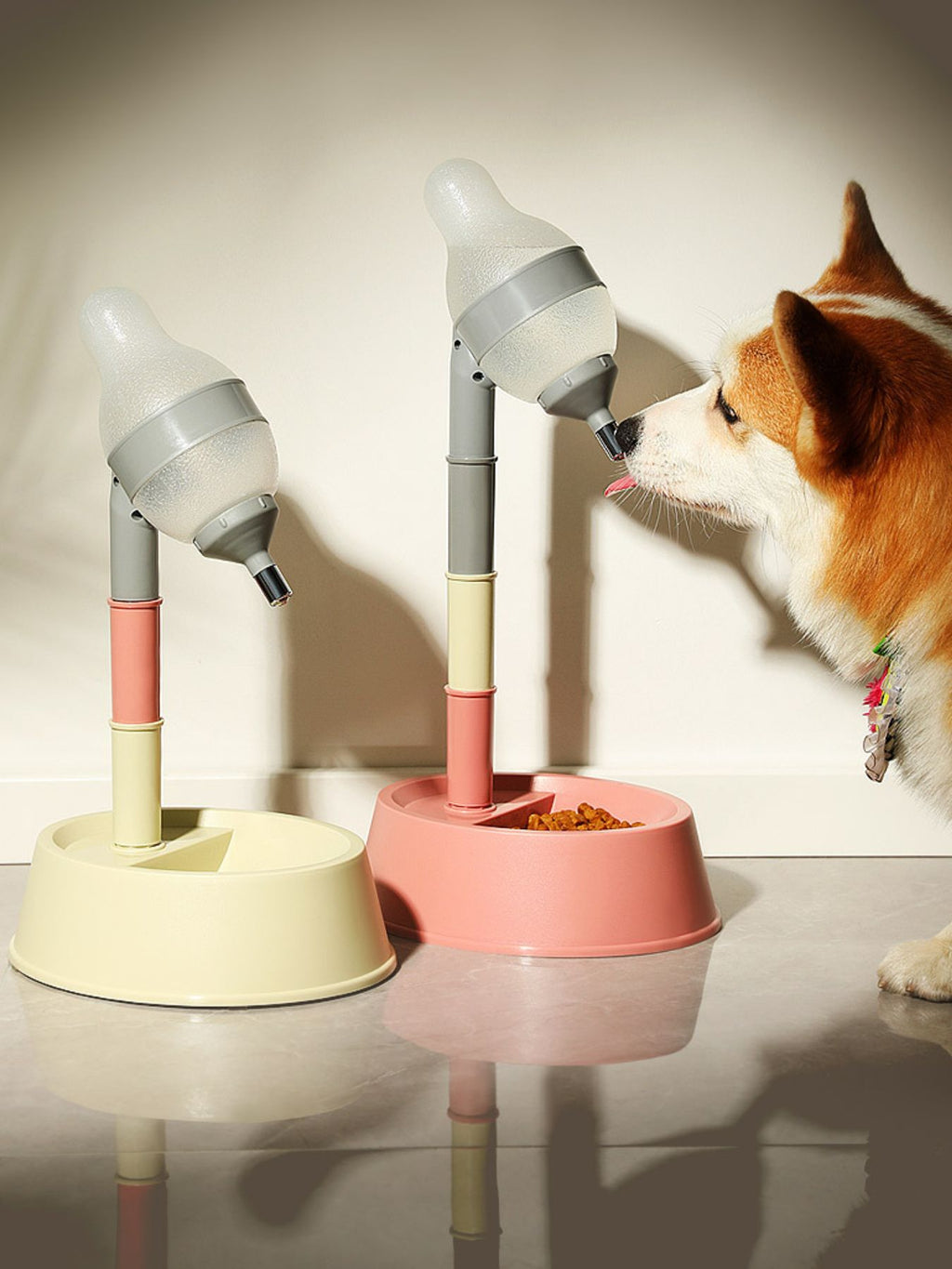 Pet water dispenser bowl, pink base, dog drinking from height-adjustable nozzle