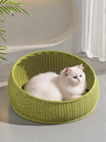Green round woven rattan pet nest with white cat inside