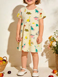Kids casual dress in pastel yellow with cartoon dinosaur print, short sleeves
