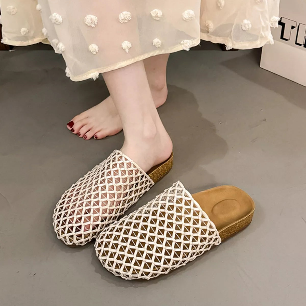 Woven mesh slip-on sandals in white with open backless heel and woven lattice pattern