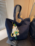 Denim shoulder bag in dark navy with cute charm and long top handles