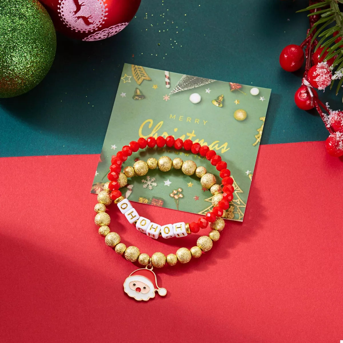 Red & gold beaded bracelet with HO HO HO beads and Santa face charm