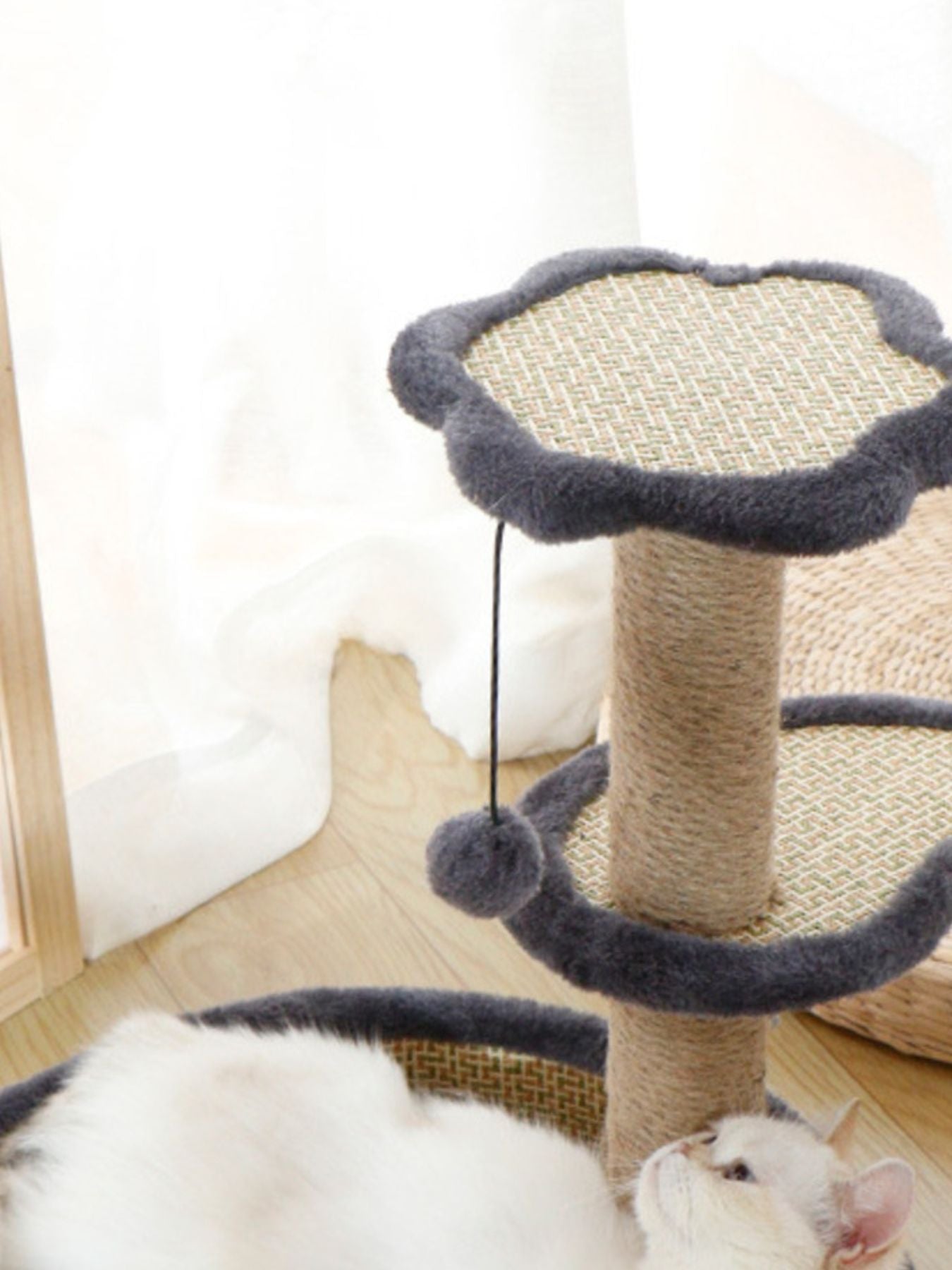 Top platform and post of cat scratching unit, gray woven surface with dark blue padded rim