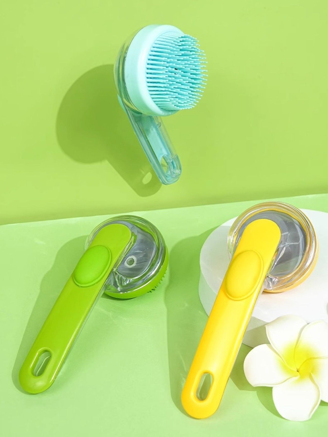 Two Soft Pet Shower Brushes in light blue and yellow, each with round bristle head