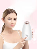 Facial steamer device with rose-gold steam nozzle, white body