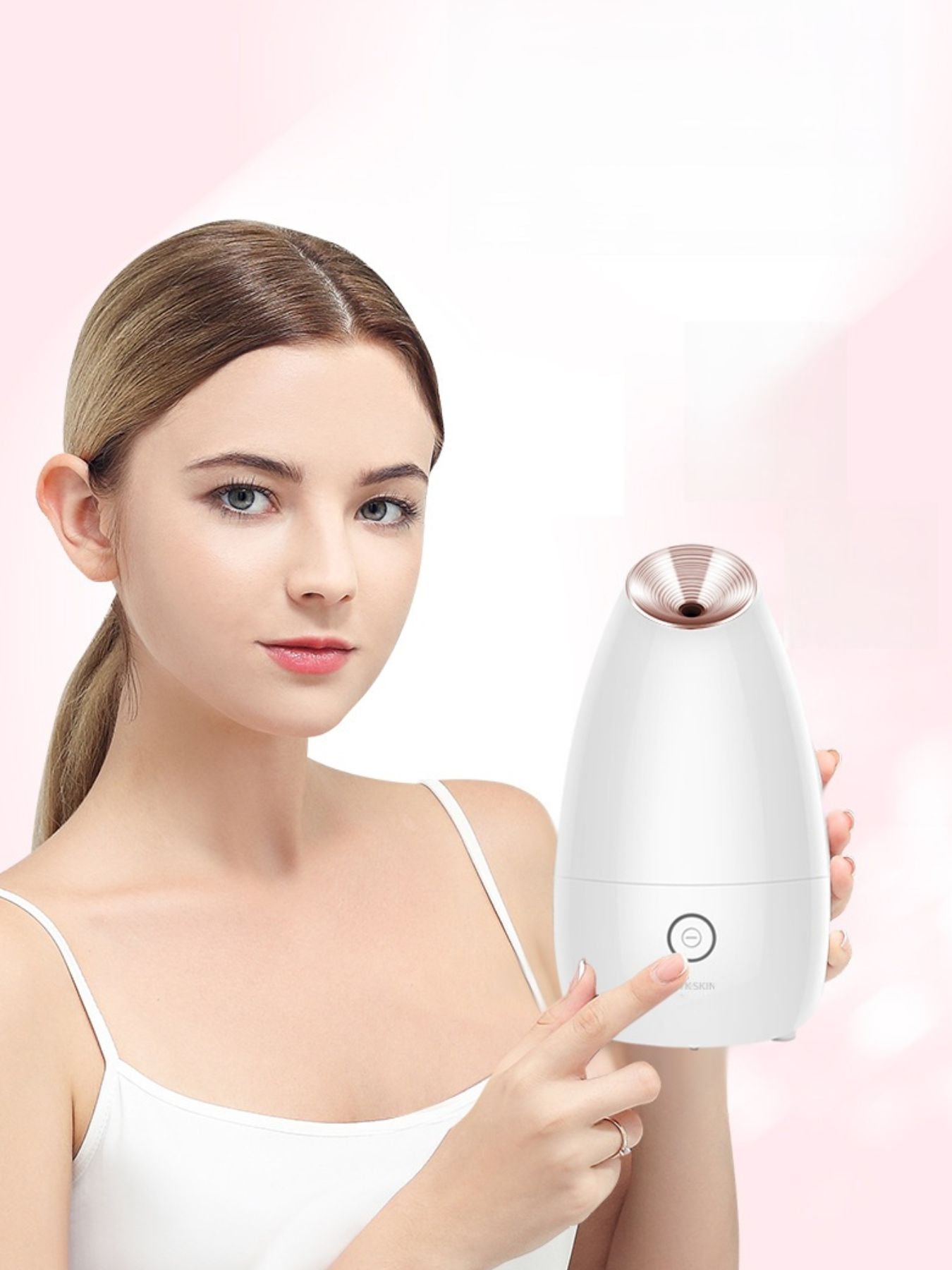 Facial steamer device with rose-gold steam nozzle, white body