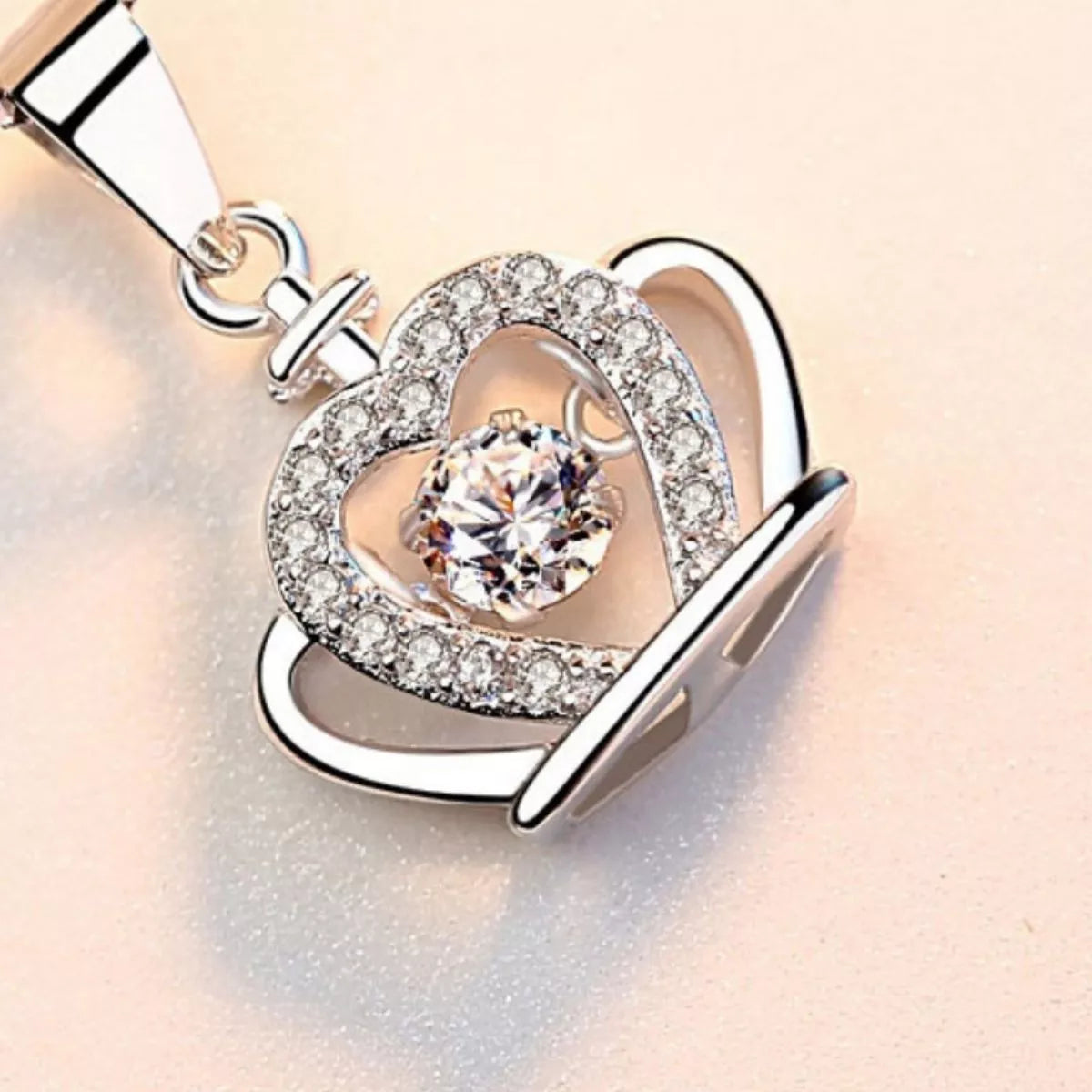 Heart-and-crown zircon pendant necklace with round stone centerpiece on chain