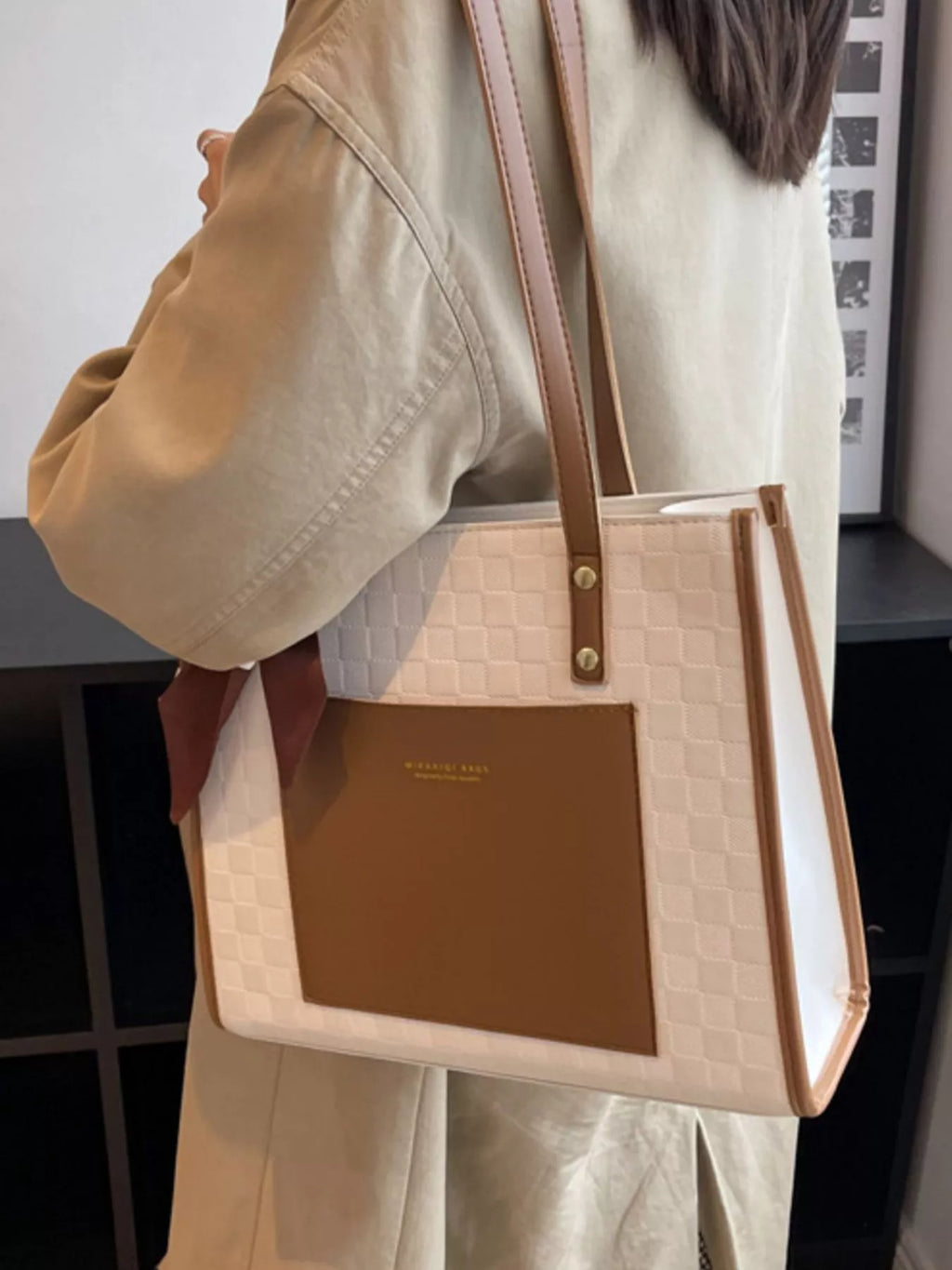 White color block shoulder bag with brown front panel and carry handles