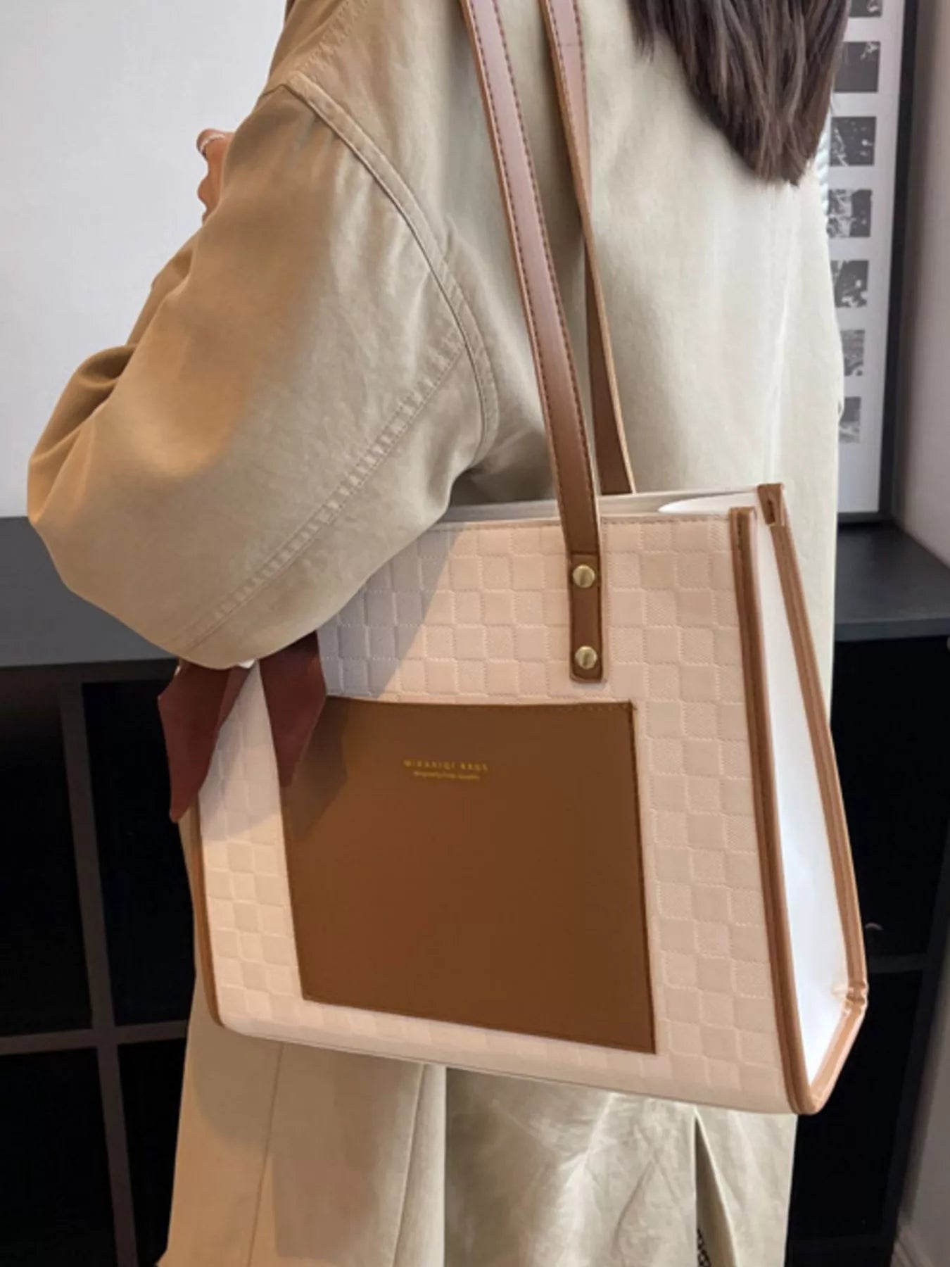 White color block shoulder bag with brown front panel and carry handles