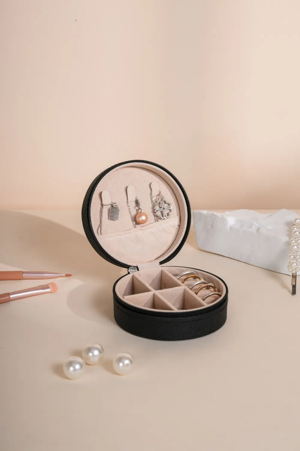 Black PU leather jewelry box open with necklace and ring compartments