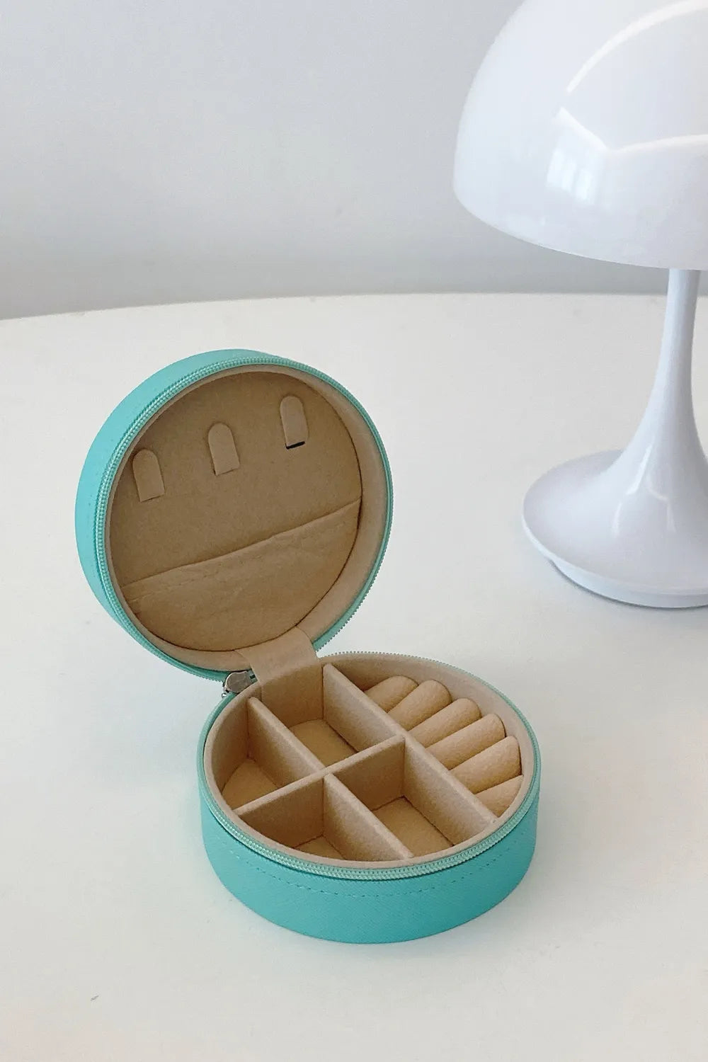 Turquoise round PU leather jewelry storage box with zipper, open interior organizer inserts