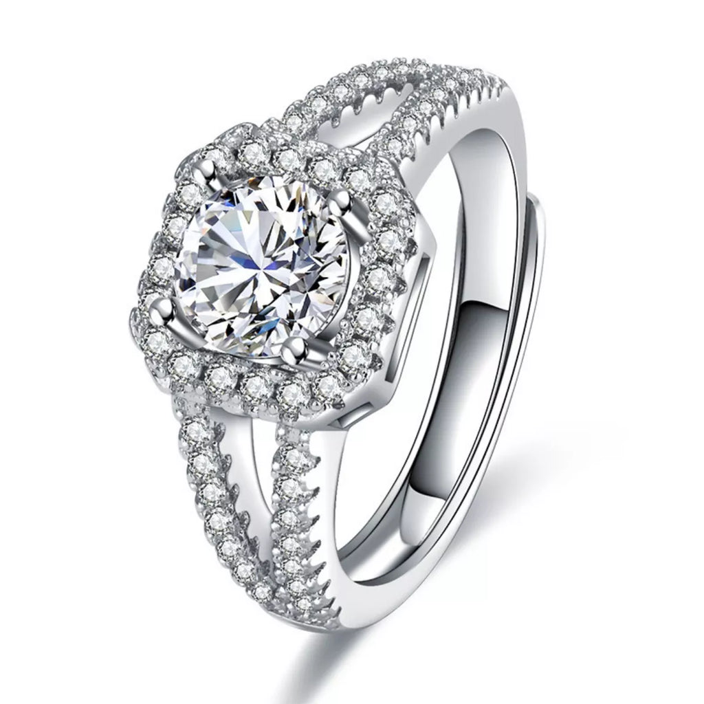 Silver 925 sterling silver moissanite halo ring close-up, pavé edge and round center stone