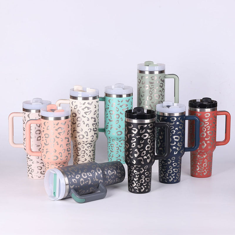 Assorted 40 oz insulated tumblers with handles, straws, and lids in multiple colors