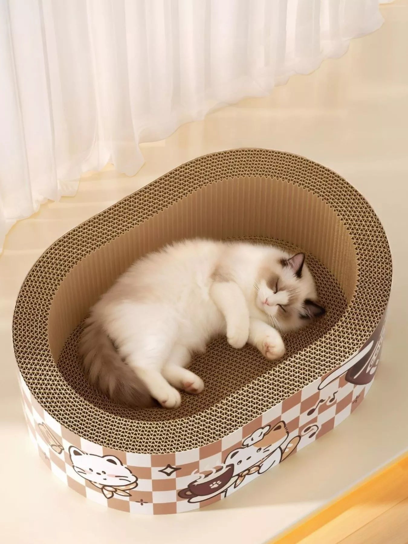Round cat scratching lounge bed with cartoon border, cardboard scratch surface