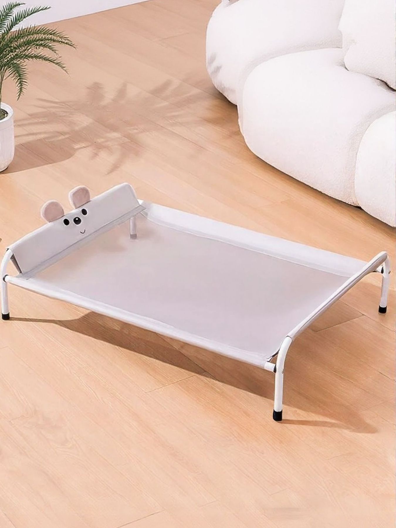 Cat Pet Bed with white fabric base, raised edges, and mouse-shaped front