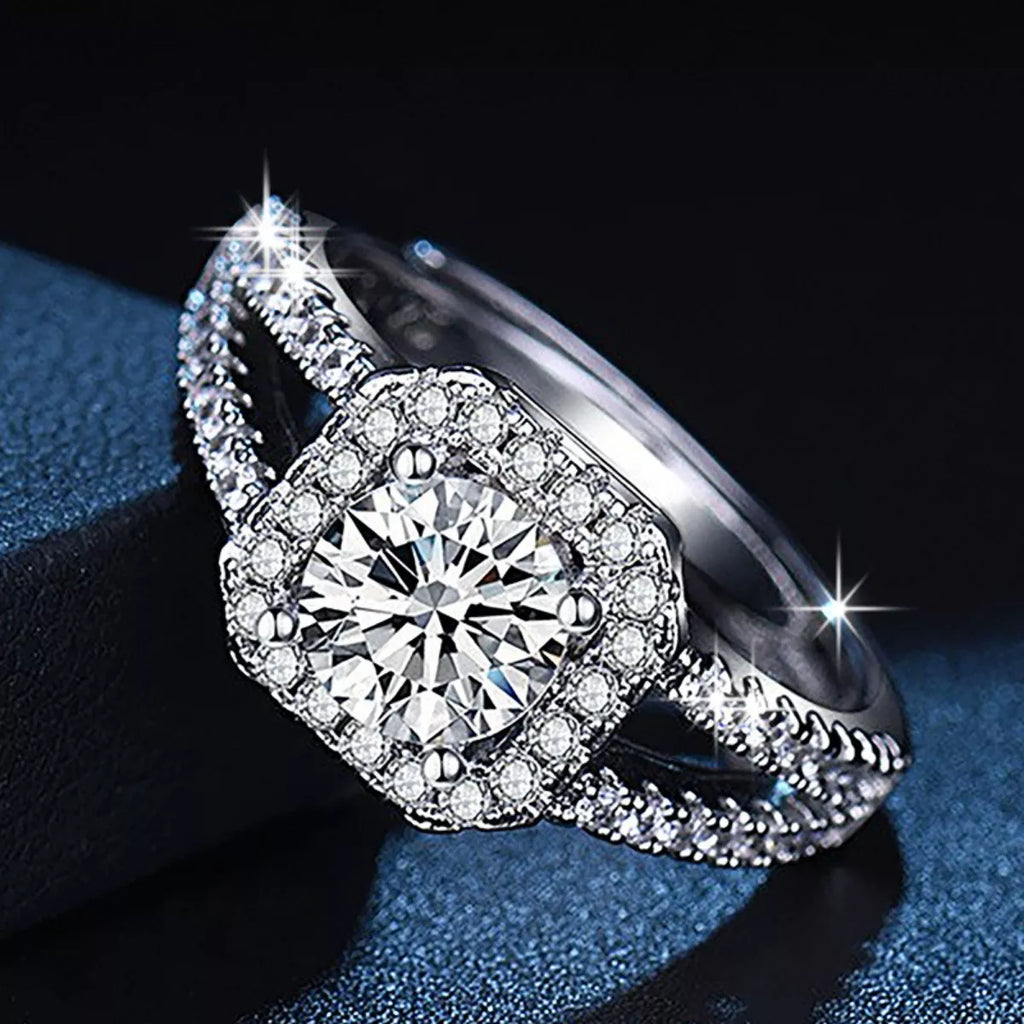 925 sterling silver moissanite ring, angled side view with pavé band and round center stone