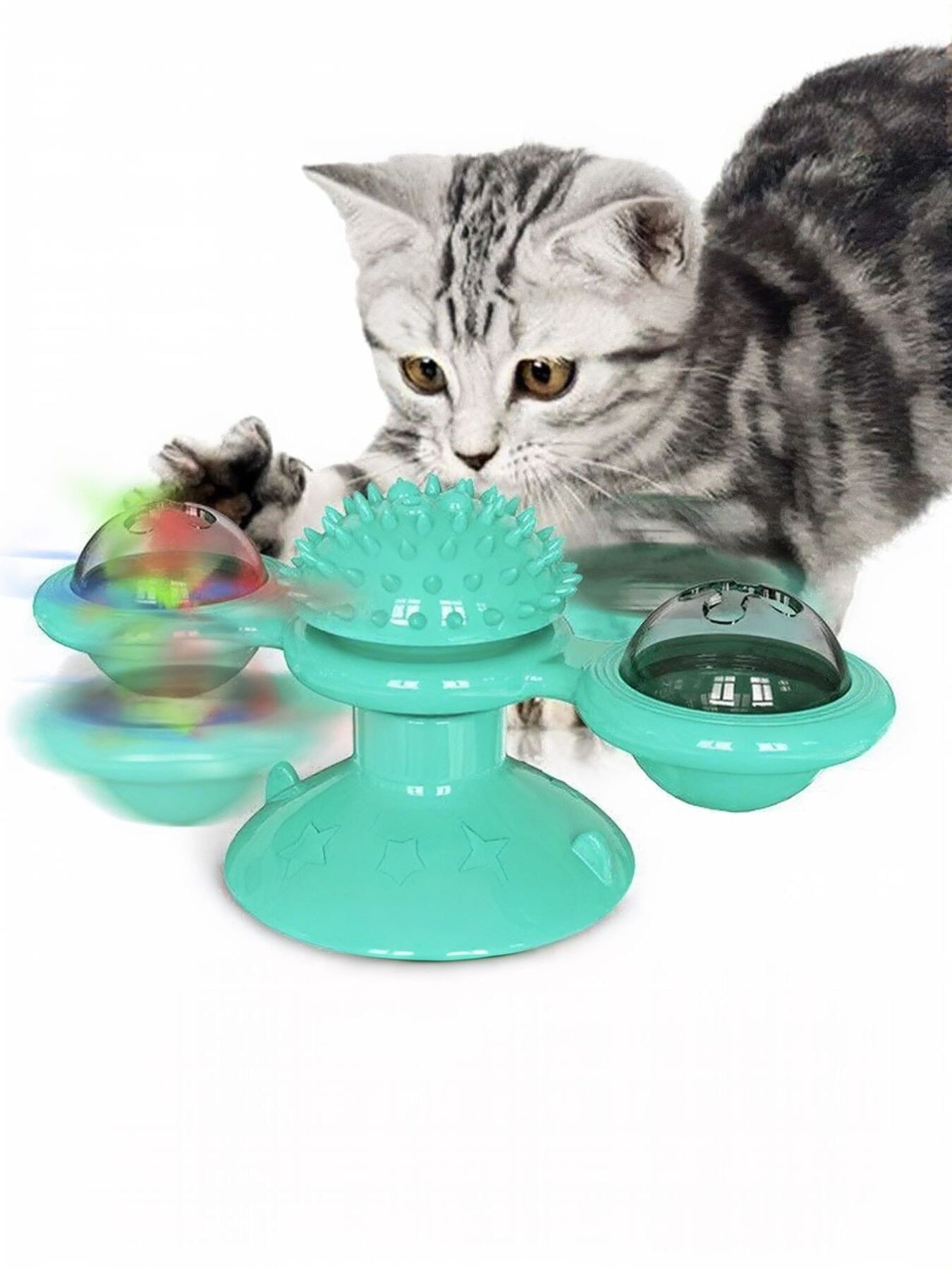 Blue-green rotating cat toy with three suction cup pods and spiky center wheel