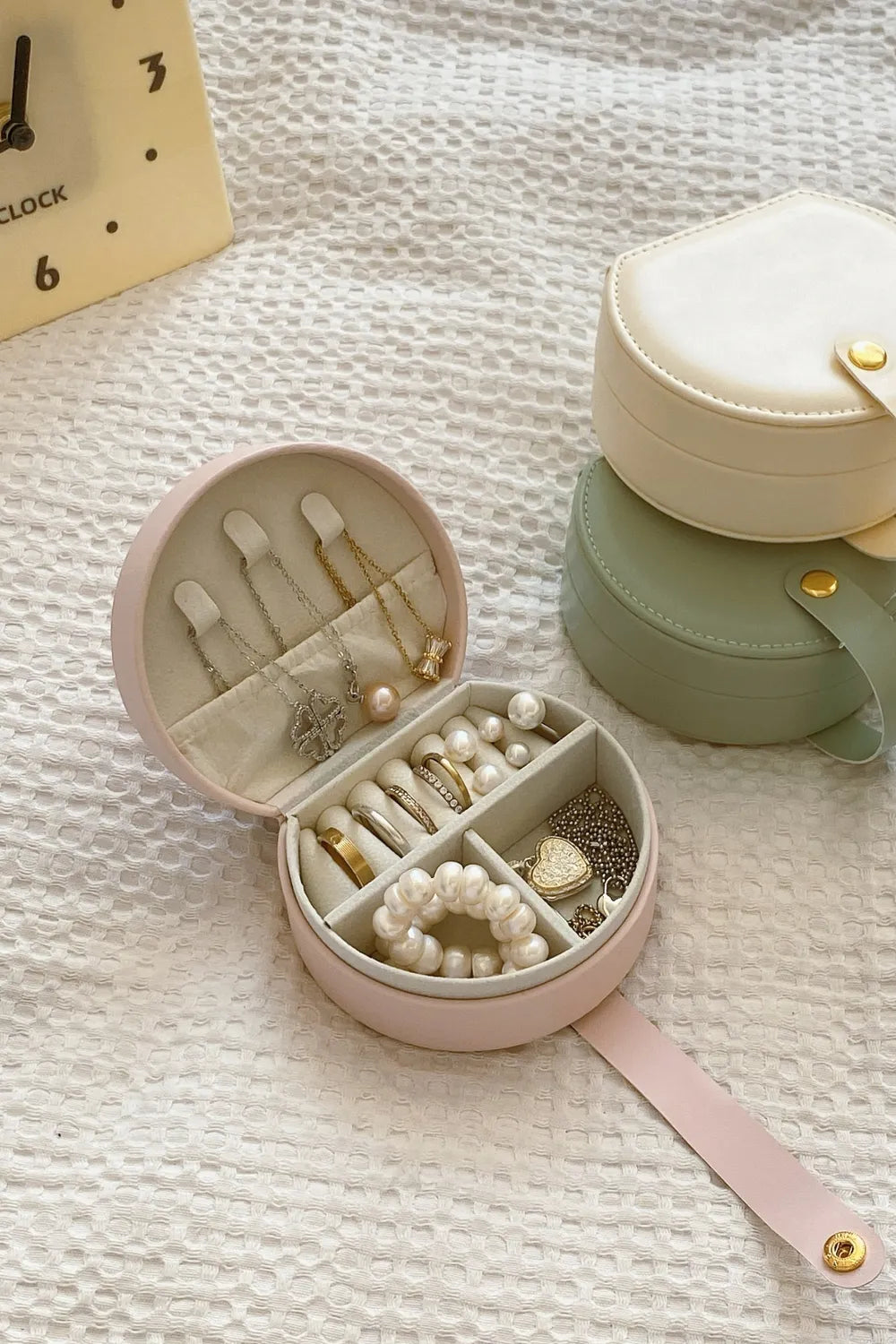 Cream and blush pink PU leather travel jewelry boxes open with ring and pearl storage
