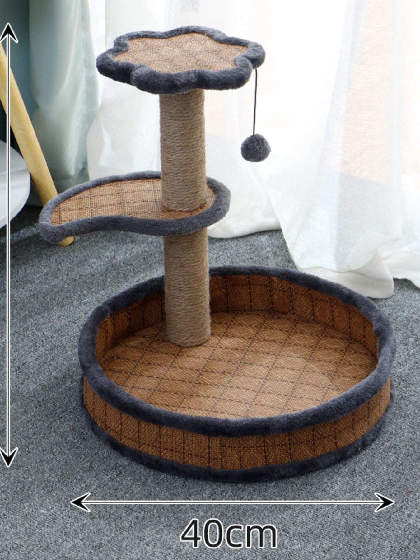 Round cat bed and scratching post with gray woven top, dark blue border, dangling pom-pom toy