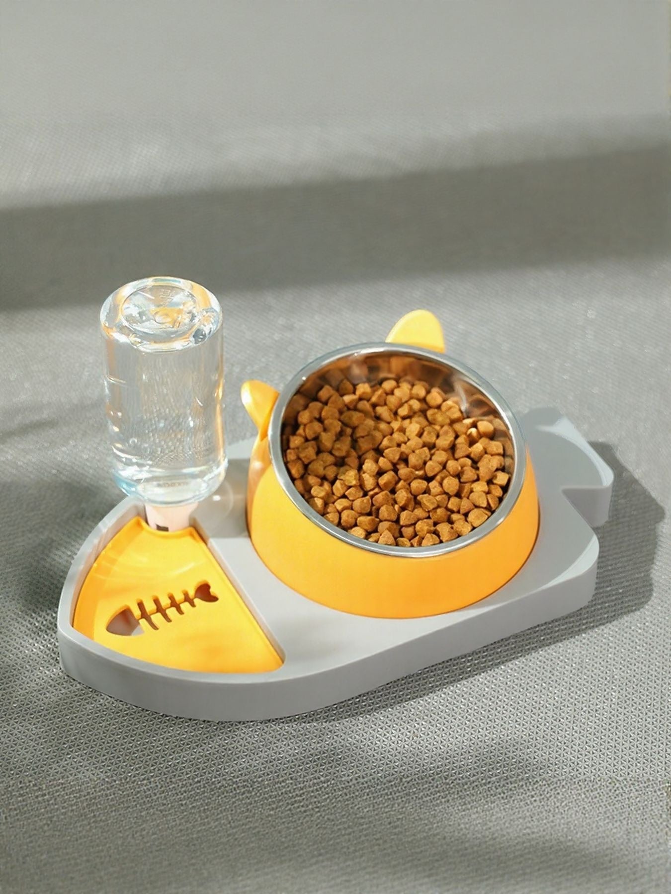 Automatic water refill pet bowl with yellow base, stainless bowl, and water bottle