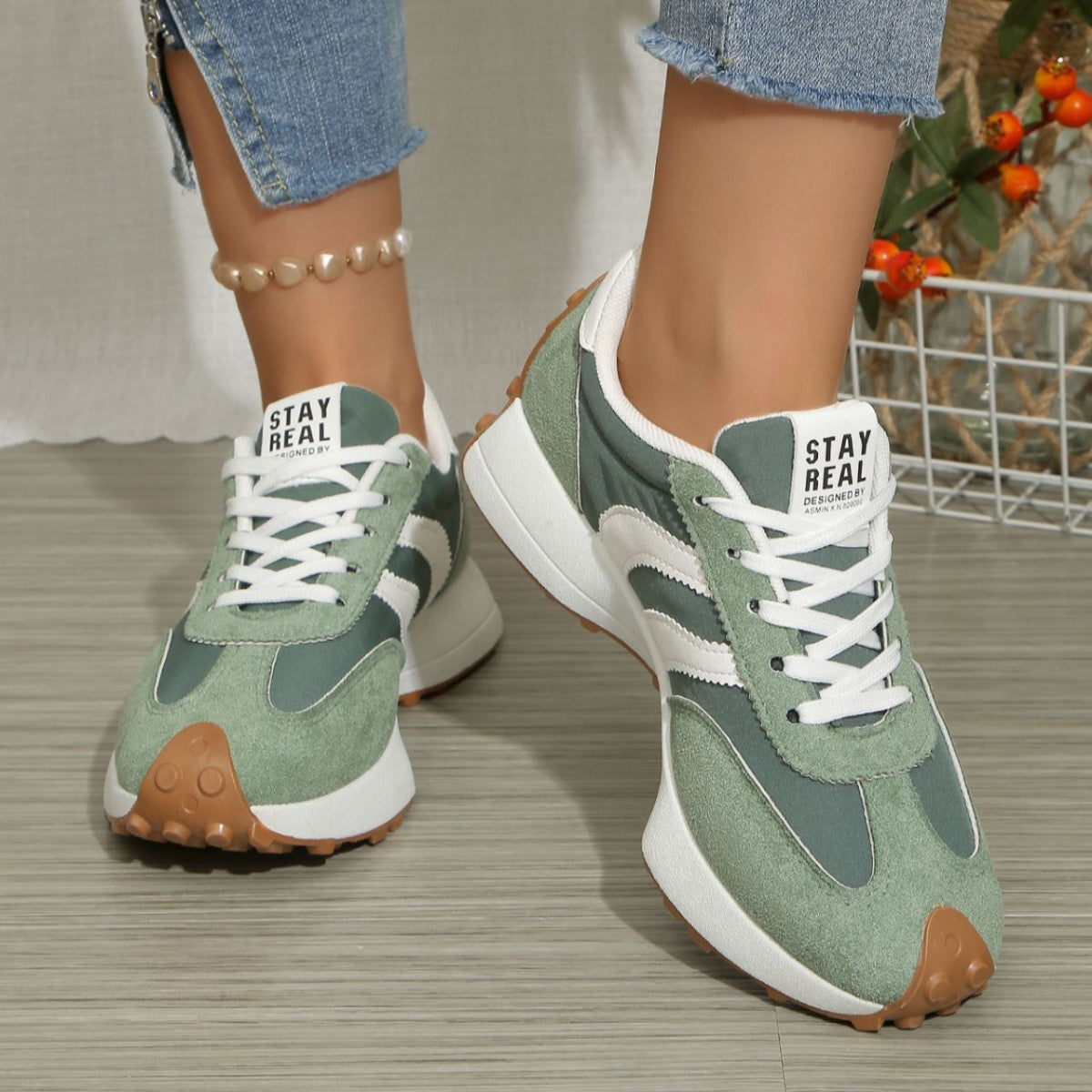 Round toe lace-up sneakers, green suede with white laces and tan tread sole